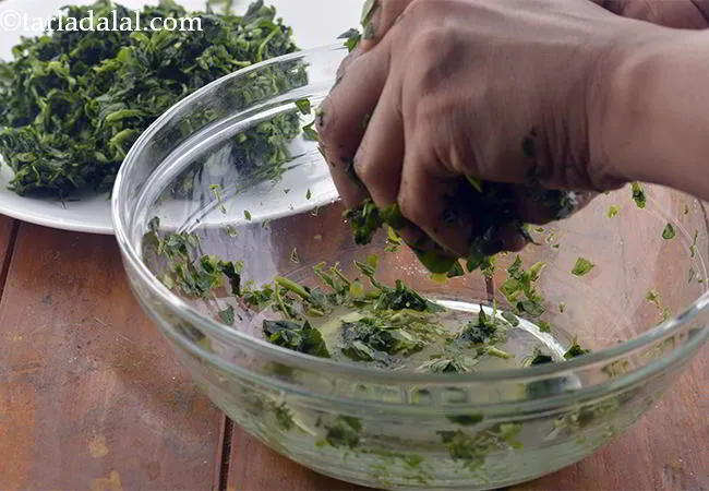 Step 1 – Take a deep bowl and put the chopped methi leaves into it. Sprinkle a little …