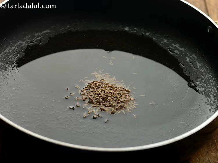 Step 3 – When the oil is hot, add the cumin seeds.