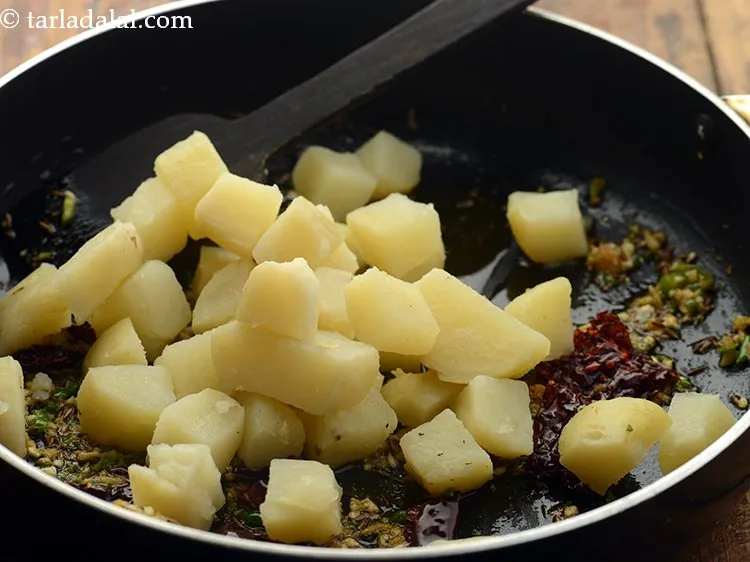 Step 10 – Add the potatoes. We have boiled the potatoes in the microwave, peeled and chopped them …