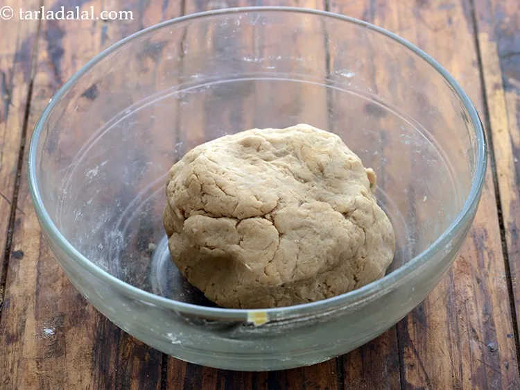 Step 5 – Take some ghee and punch and knead till smooth.