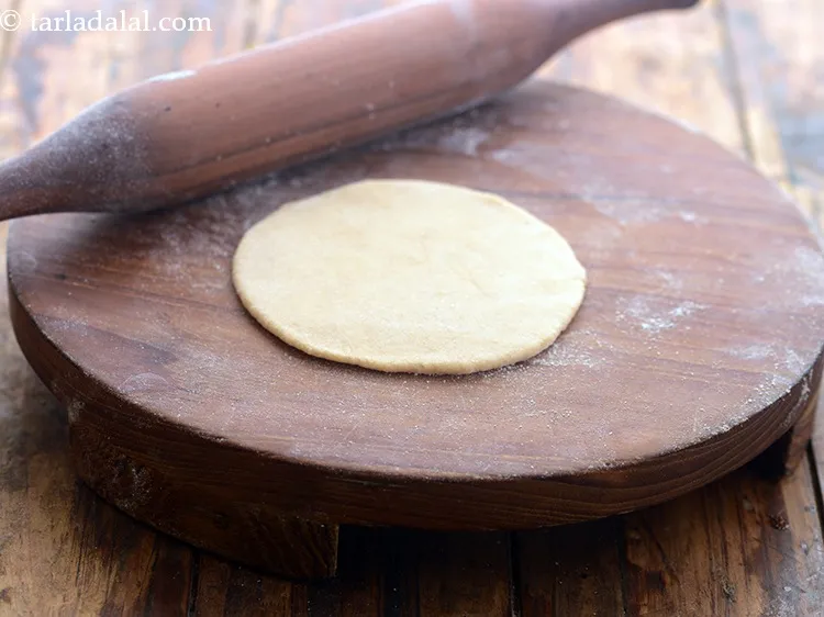 Step 18 – <p>Roll a portion of the dough into a circle of 100 mm. (4”) diameter circle …