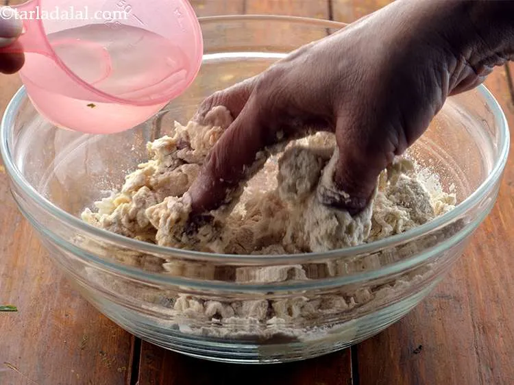 Step 4 – Add water as required and knead into a semi-stiff dough.
