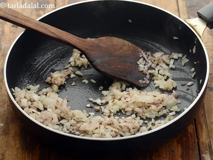 Step 8 – Once the seeds crackle add the chopped onions. Saut&eacute; the onions for 2 minutes.