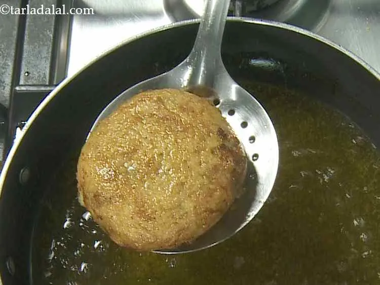 Step 13 – Heat the oil in a deep non-stick pan and deep-fry each tikki till it turns …