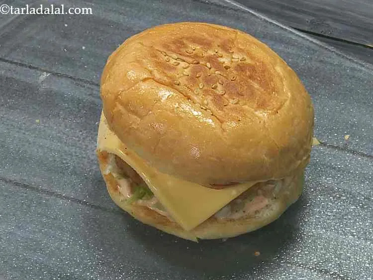 Step 25 – Cover with an upper half of the burger bun with the buttered?spread side facing downwards …