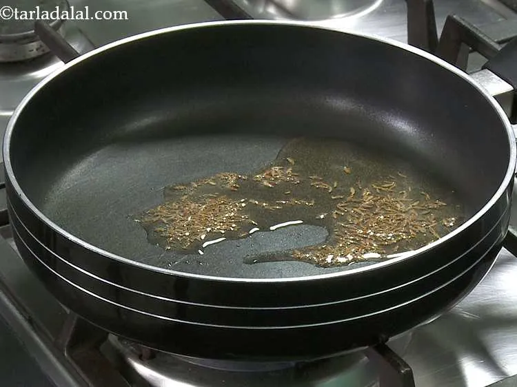 Step 2 – Heat the oil in a broad non-stick pan and add the cumin seeds and saut? …
