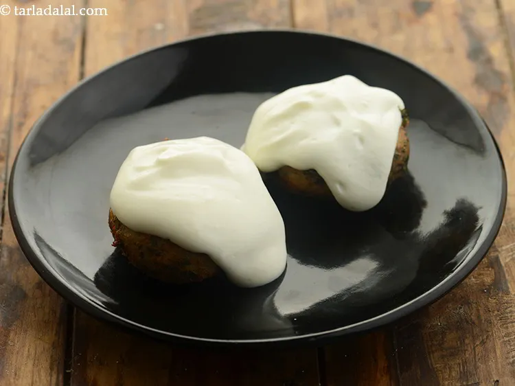 Step 19 – Spread &frac14; cup of curd-sugar mixture.