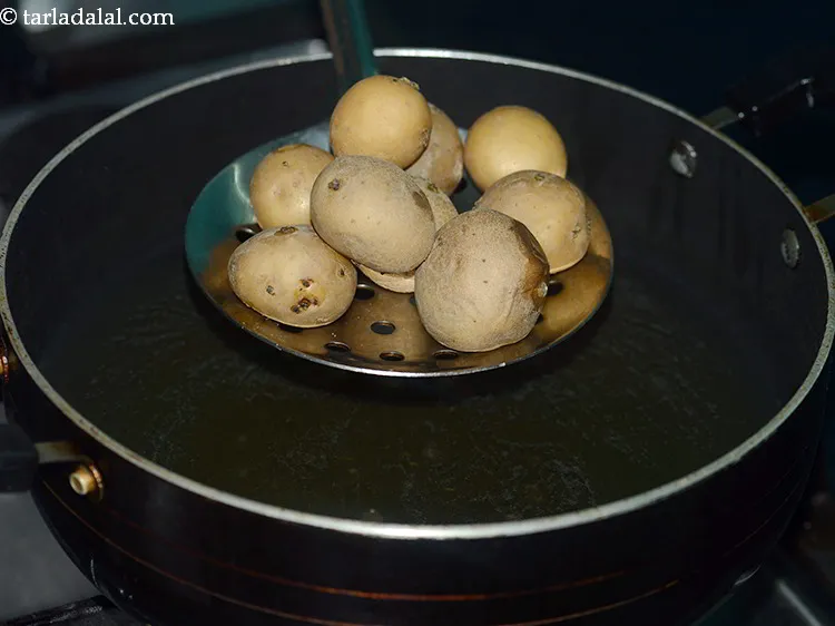 Step 15 – Add the potatoes carefully and fry them.
