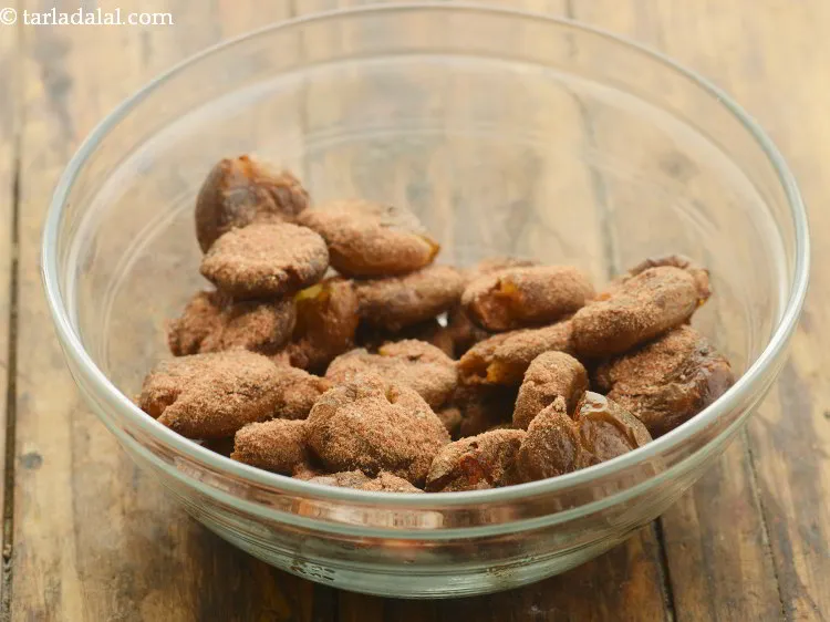 Step 23 – Add the prepared masala powder on <strong>Sindhi tuk</strong>. Sprinkle the masala immediately after removing from …