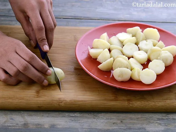 Step 8 – Cut the baby potatoes horizontally into two.