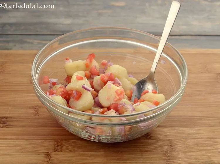 Step 10 – Add the chopped onions and tomatoes.Mix well.