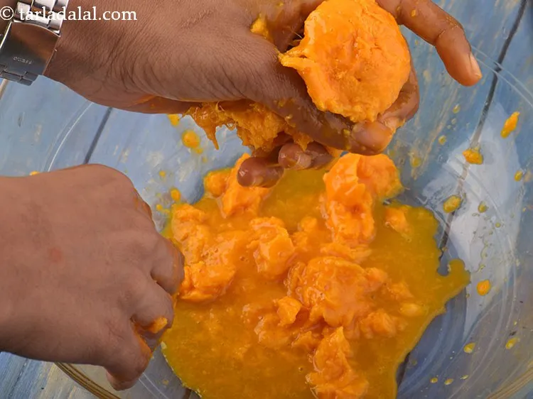 Step 13 – Repeat steps 3 to 5 with the remaining 11 mangoes and collect the mango pulp …