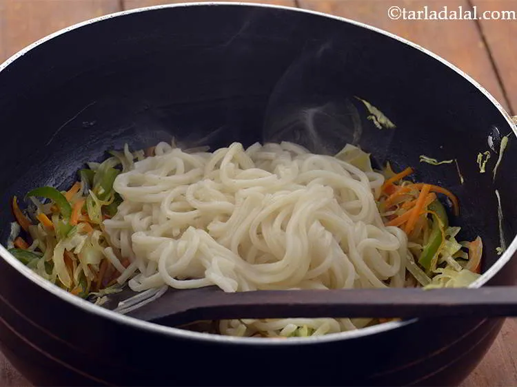 Step 23 – Add the boiled hakka noodles.