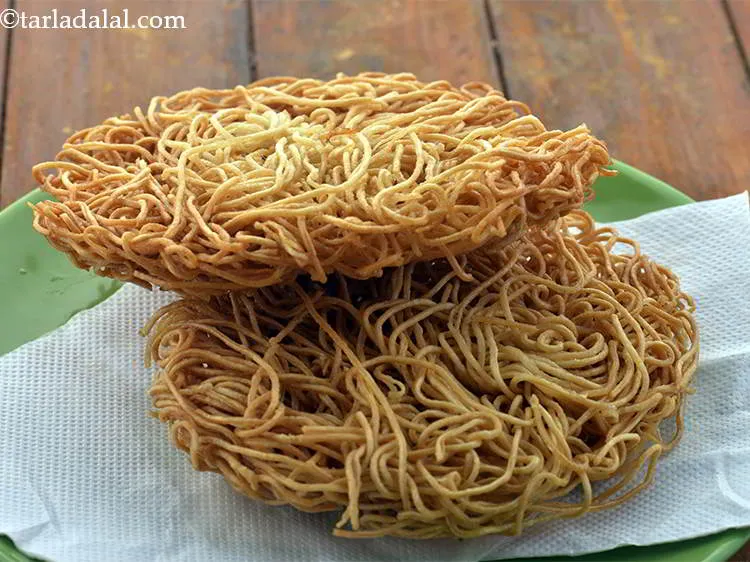 Step 12 – In the same way,deep fry the remaining 2 cups of noodles to make one more …