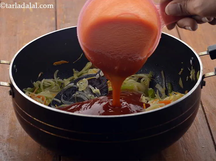 Step 25 – Add the tomato ketchup. It provides a tangy flavor to the <strong>chopsuey</strong>.
