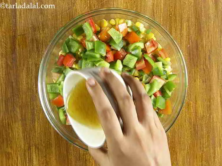Step 20 – Pour the prepared vinaigrette dressing over the&nbsp;<strong>American sweet corn salad</strong>.