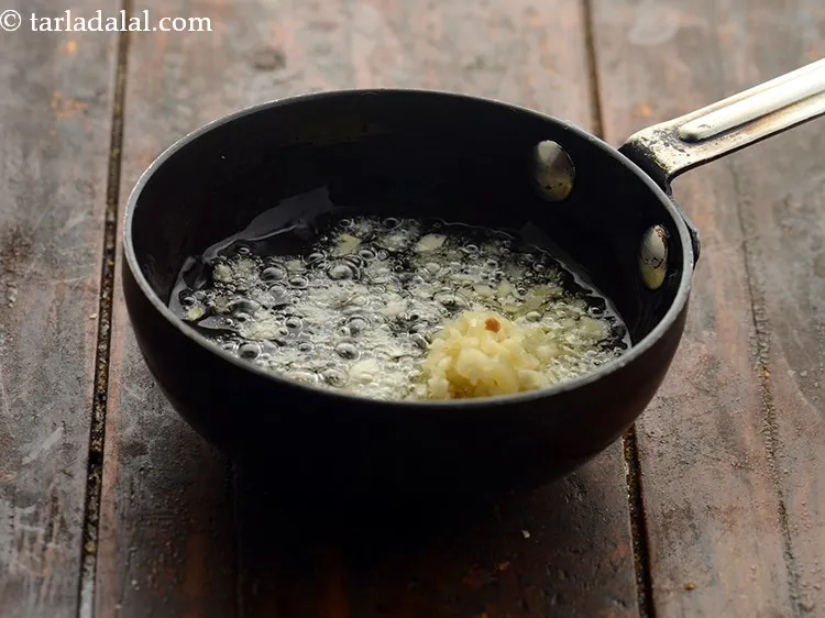 Step 18 – Add the garlic. You can also add mustard seeds if you wish to.