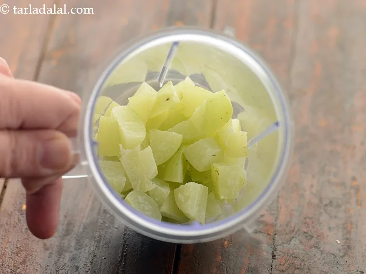 Step 11 – Transfer the chopped amla into a mixer jar.