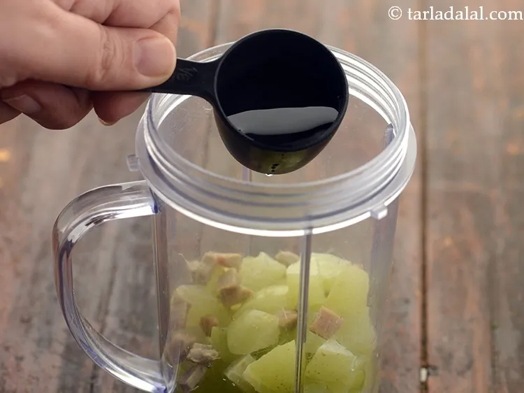 Step 13 – Add &frac14; cup of water to ease the process of blending.