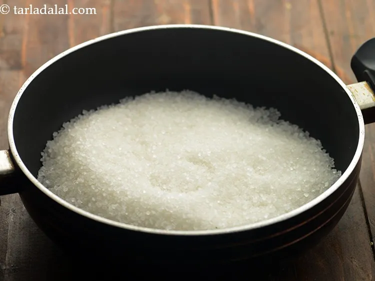 Step 9 – To make sugar syrup for amla murabba, in a deep non-stick pan take sugar. You …