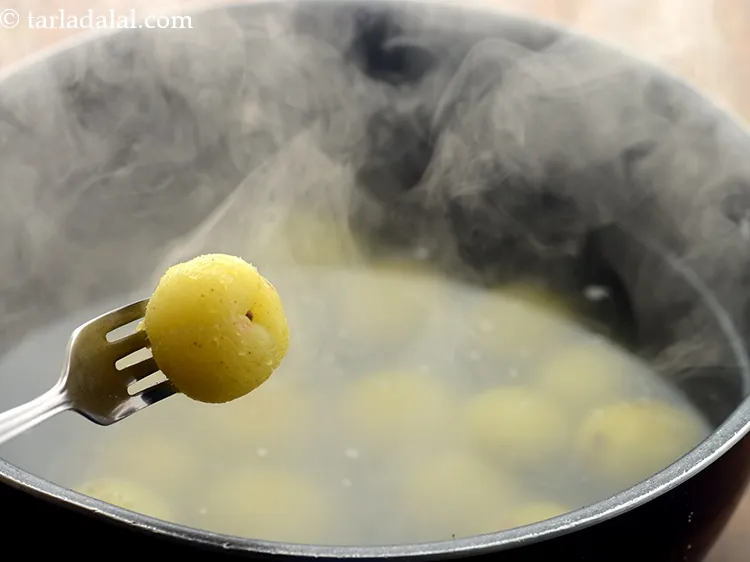 Step 8 – After 10 minutes, drain the amlas and keep aside.