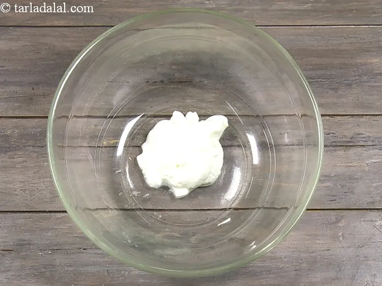 Step 3 – For the <strong>Tandoori vegetable mixture</strong>, add 1/4 cup&nbsp;<a href="https://www.tarladalal.com/glossary-thick-curds-2097i">thick curds (dahi)</a> into a deep bowl. …