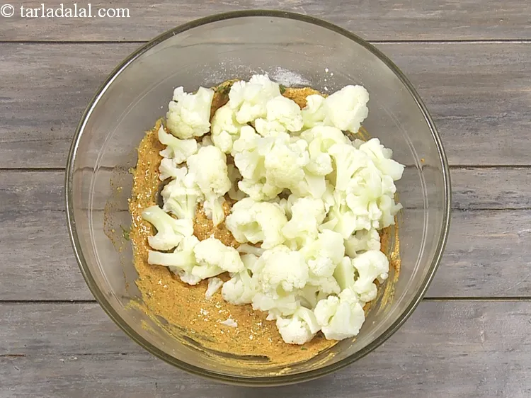 Step 16 – Add&nbsp;2 cups&nbsp;parboiled&nbsp;<a href="https://www.tarladalal.com/glossary-cauliflower-florets-753i">cauliflower florets</a>.