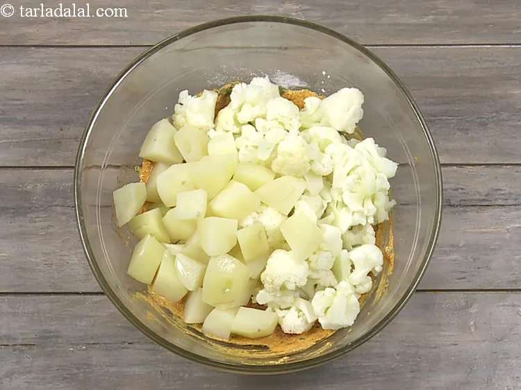Step 17 – Add 1 cup&nbsp;<a href="https://www.tarladalal.com/glossary-parboiled-potato-cubes-2420i">parboiled potato cubes</a>.