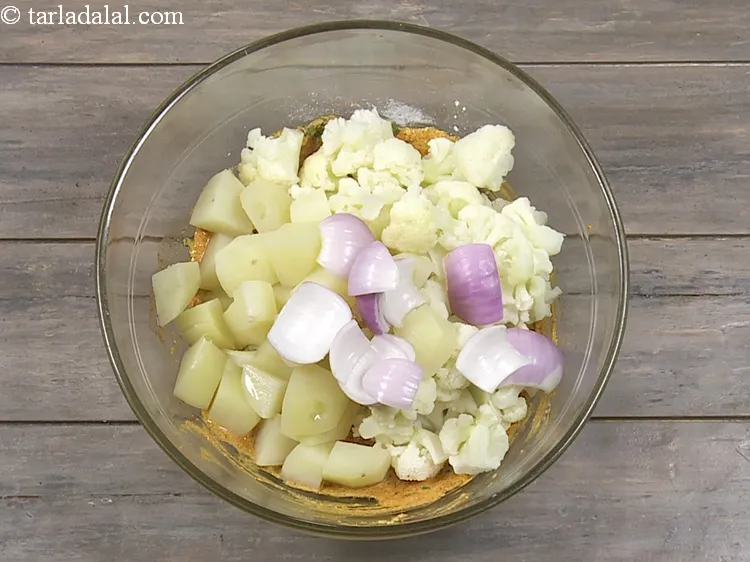 Step 18 – Add 1/4 cup&nbsp;<a href="https://www.tarladalal.com/glossary-onion-cubes-732i">onion cubes</a>.&nbsp;