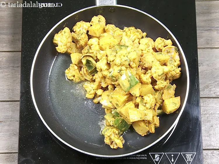 Step 22 – Add the Tandoori vegetable mixture.