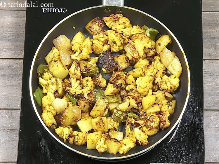 Step 24 – Now cook on a high flame for 8 minutes, while tossing it occasionally. At this …