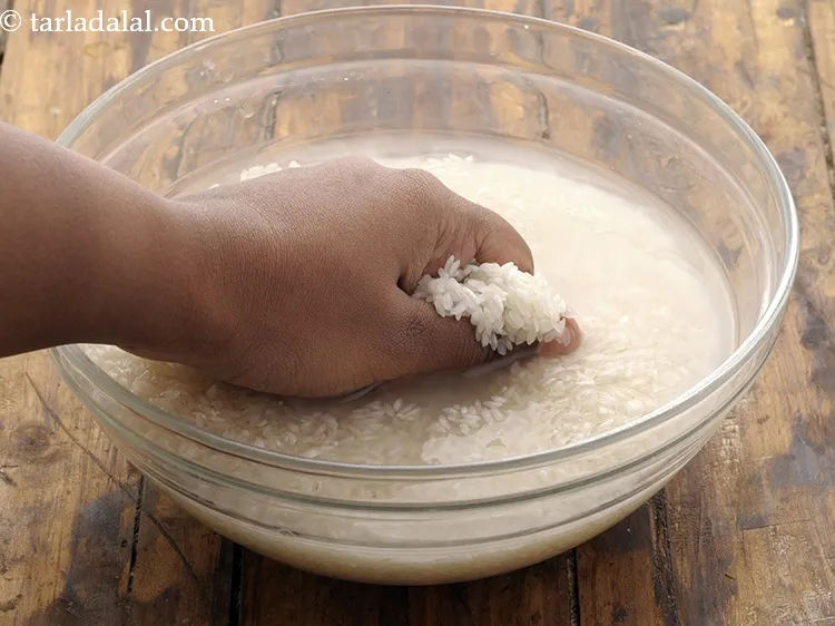 Step 2 – Raw rice needs to be washed thoroughly.