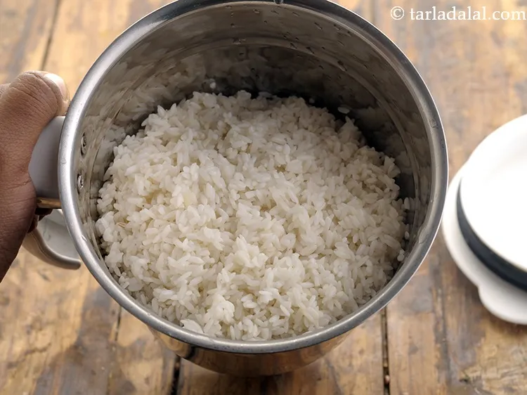 Step 7 – To make the batter for <strong>Appam</strong>, in a mixer jar add soaked and drained rice.