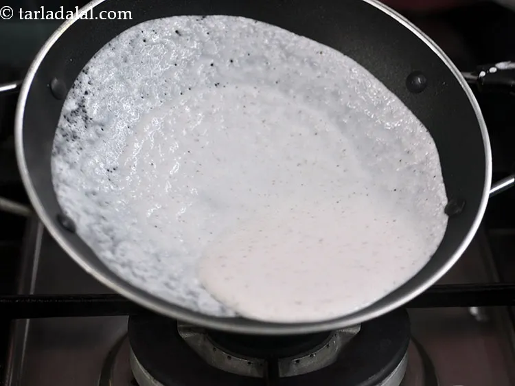 Step 30 – Holding both the handles of the pan, slowly rotate the kadhai in a circular motion …