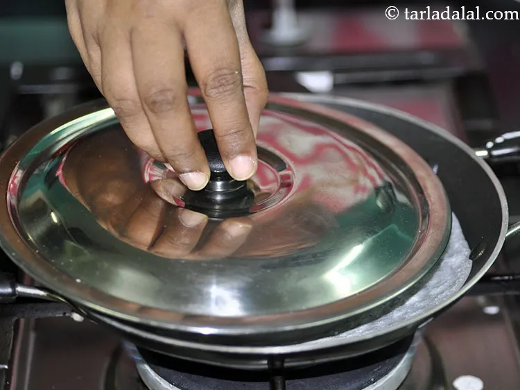 Step 22 – Cover&nbsp;<strong>appam recipe without yeast | &nbsp;Kerala appam | &nbsp;palappam |</strong>&nbsp;with a lid and cook on …