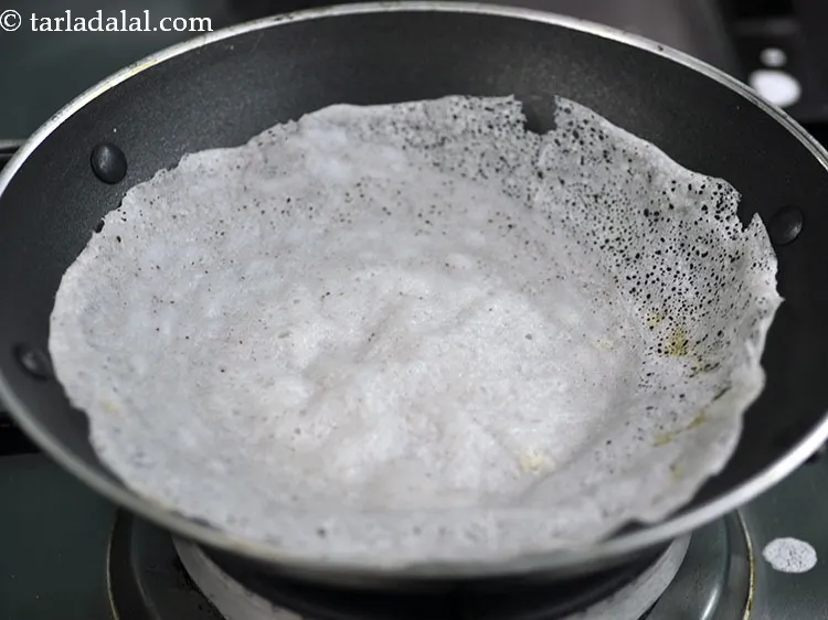 Step 23 – Remove the <strong>appam</strong> when the center fluffy part is cooked and the edges start turning …