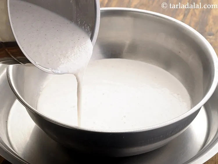 Step 11 – Remove the ground rice paste in a deep bowl.