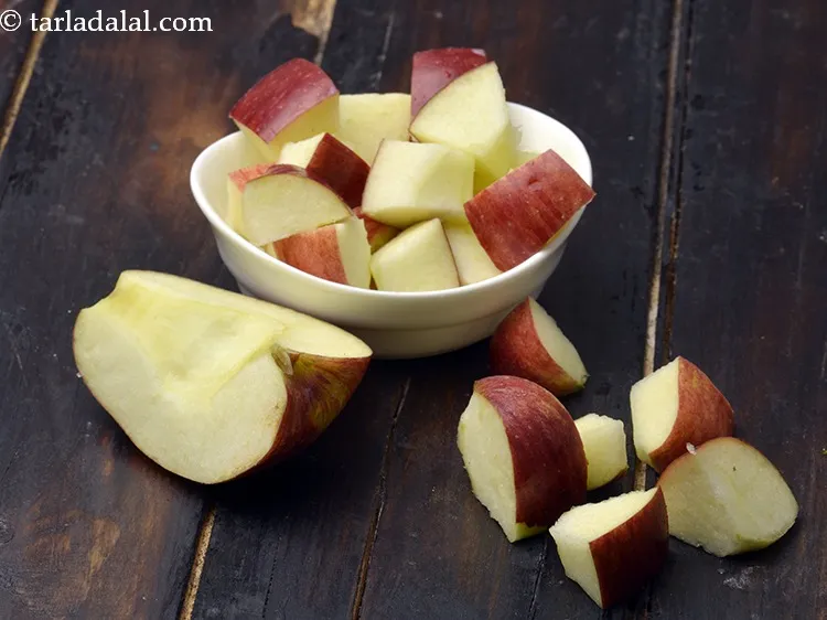 Step 8 – Similarly wash the apple, cut into cubes and add a few apple cubes at a …