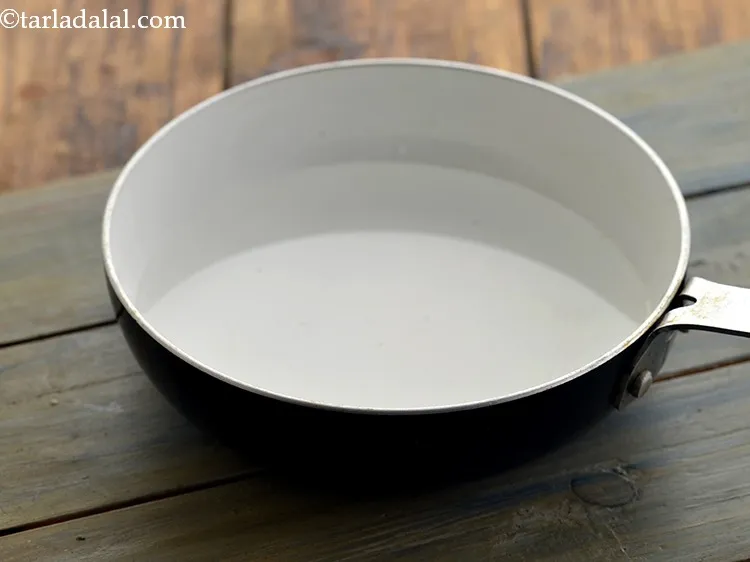 Step 16 – Meanwhile take a broad non-stick pan, add &frac34; cup of water to it and bring …