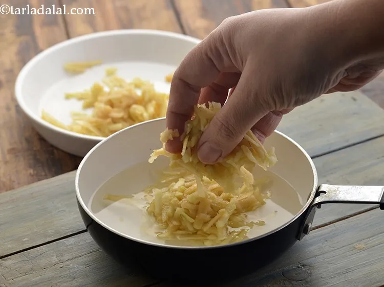 Step 17 – Switch off the flame and add grated apple to it and mix well.&nbsp;