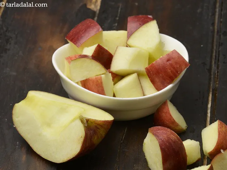 Step 9 – Next make cubes of apple also and add them to the juicer a few at …