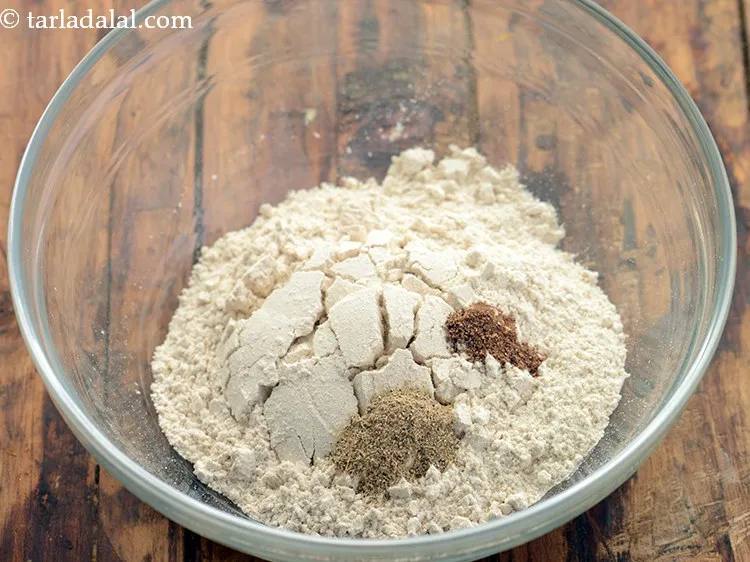 Step 3 – Add nutmeg powder. Both elaichi and jaiphal enhance the flavor of <strong>atta biscuits</strong>.