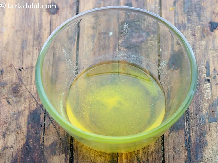 Step 6 – In another bowl, take melted ghee. Ghee can be swapped with butter.