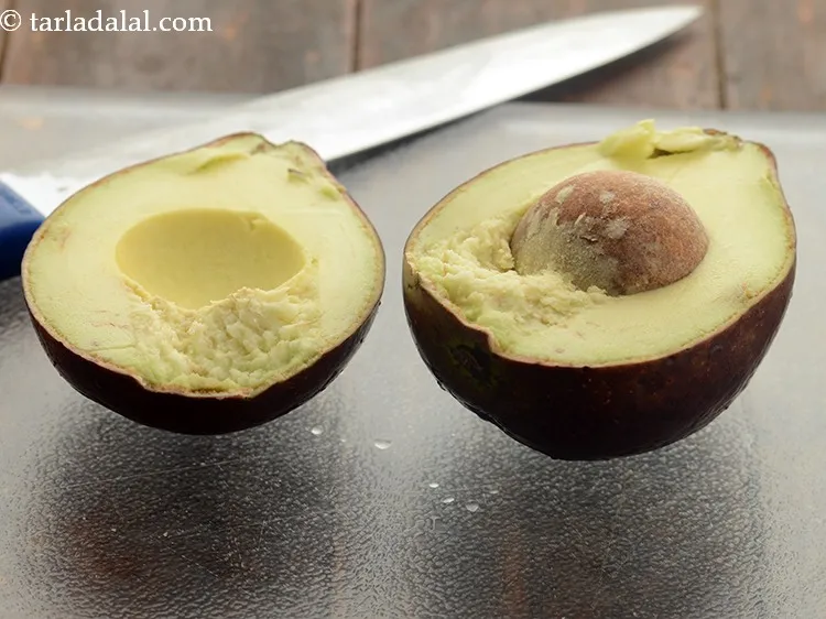 Step 8 – Cut the avocado in 2 halves using a sharp knife.