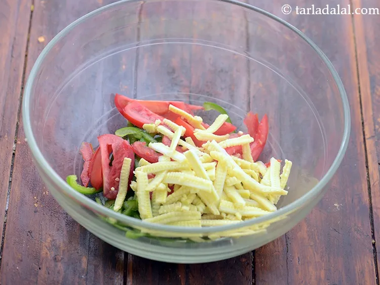 Step 17 – Add sliced and blanched baby corn.