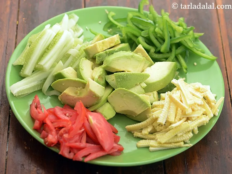 Step 8 – Cut and keep all the vegetables ready for&nbsp;<strong>tomato avocado salad</strong>. Keep aside.