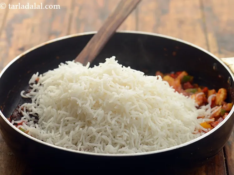 स्टेप 20 – चावल डालें। हमने यहा सफेद चावल का उपयोग किया है, …