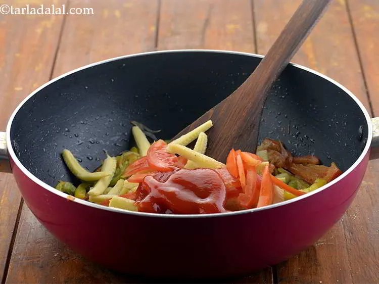 Step 12 – Now add the tomato ketchup for a mildly sweet taste.