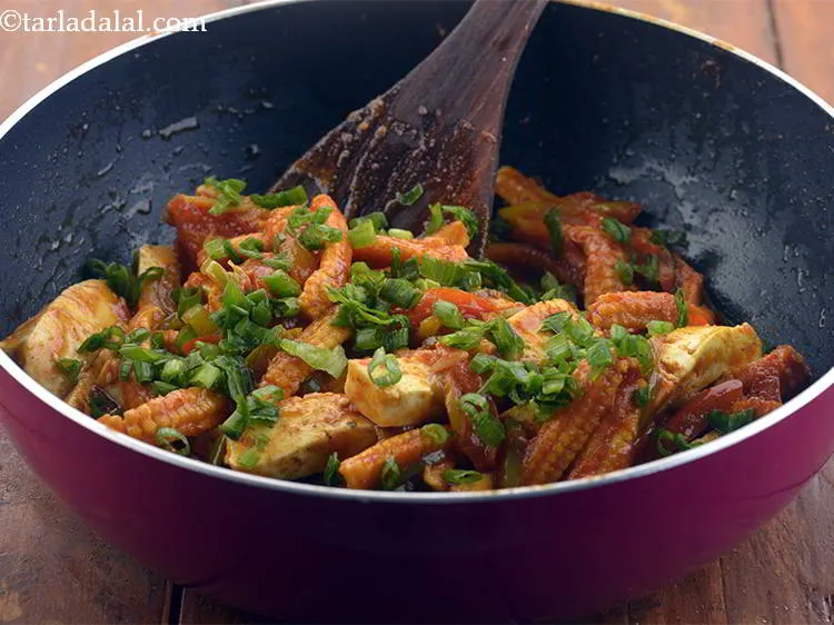 Step 20 – Add the spring onion greens now.&nbsp;