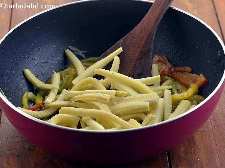 Step 7 – Now, add the baby corn. This is diagonally cut and blanched. Blanching is the process …